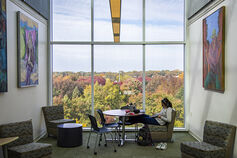 An IUSB student studying in Schurz library.